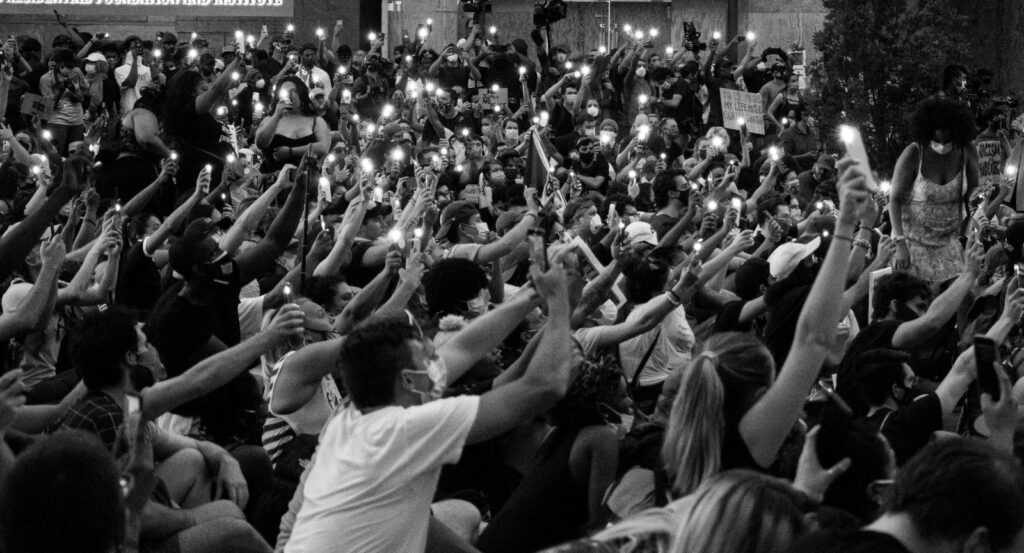 Picture of protesters holding their cellphones with their lanterns on in a Black Lives Matter Protest in Washington DC on June 3rd, 2020.