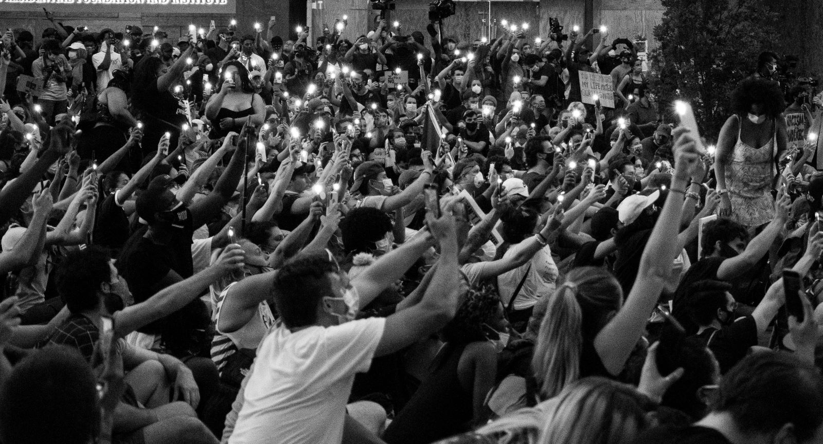 Picture of protesters holding their cellphones with their lanterns on in a Black Lives Matter Protest in Washington DC on June 3rd, 2020.